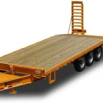 an image of a 38000 GVWR Tandem Dual Flatbed Trailer in color orange with a wood floor, used for a blog about flatbed trailer types for Kaufman Trailers